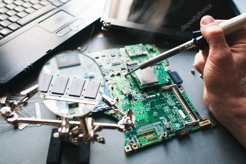 depositphotos 92848686 stock photo technician repair soldering iron computer